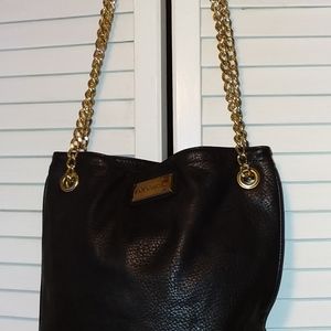 BCBG black & gold purse with gold chain straps. Gently used